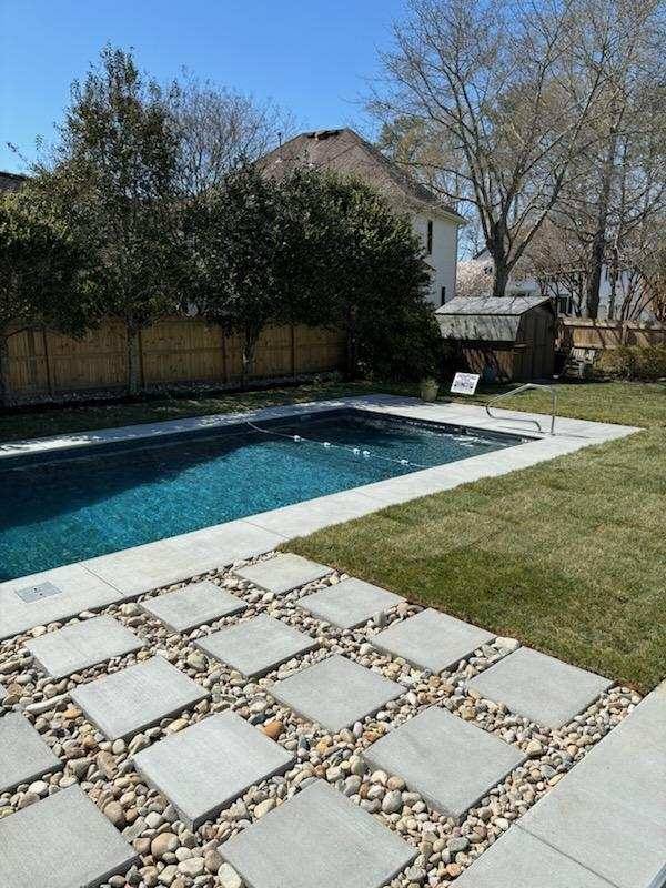 Backyard pool with a water slide