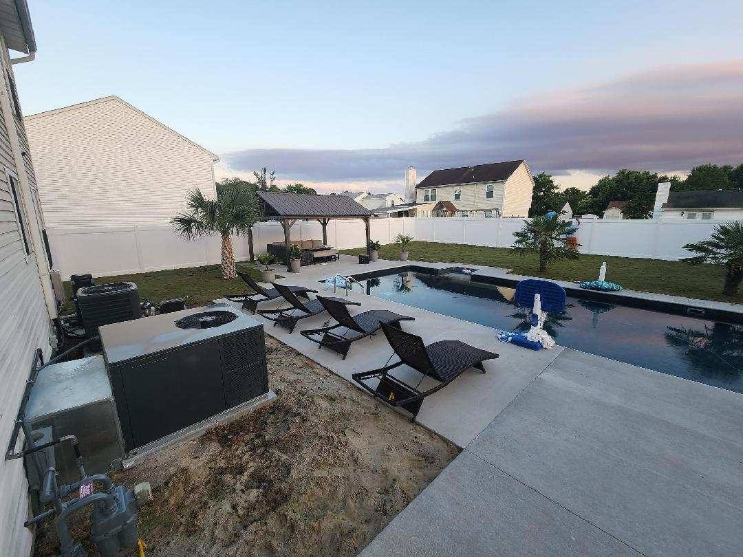 Backyard pool with a hot tub