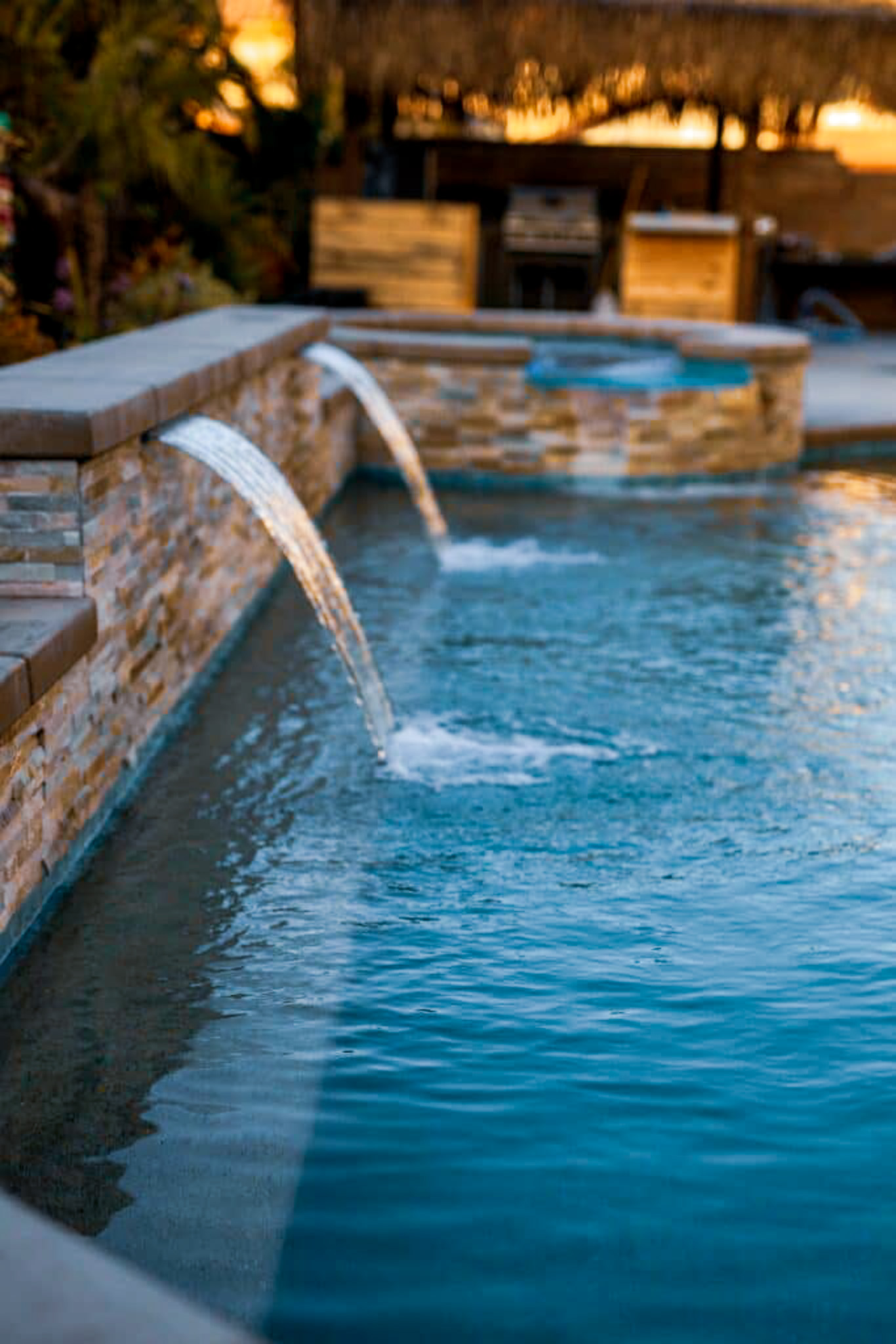 Backyard pool with a hot tub