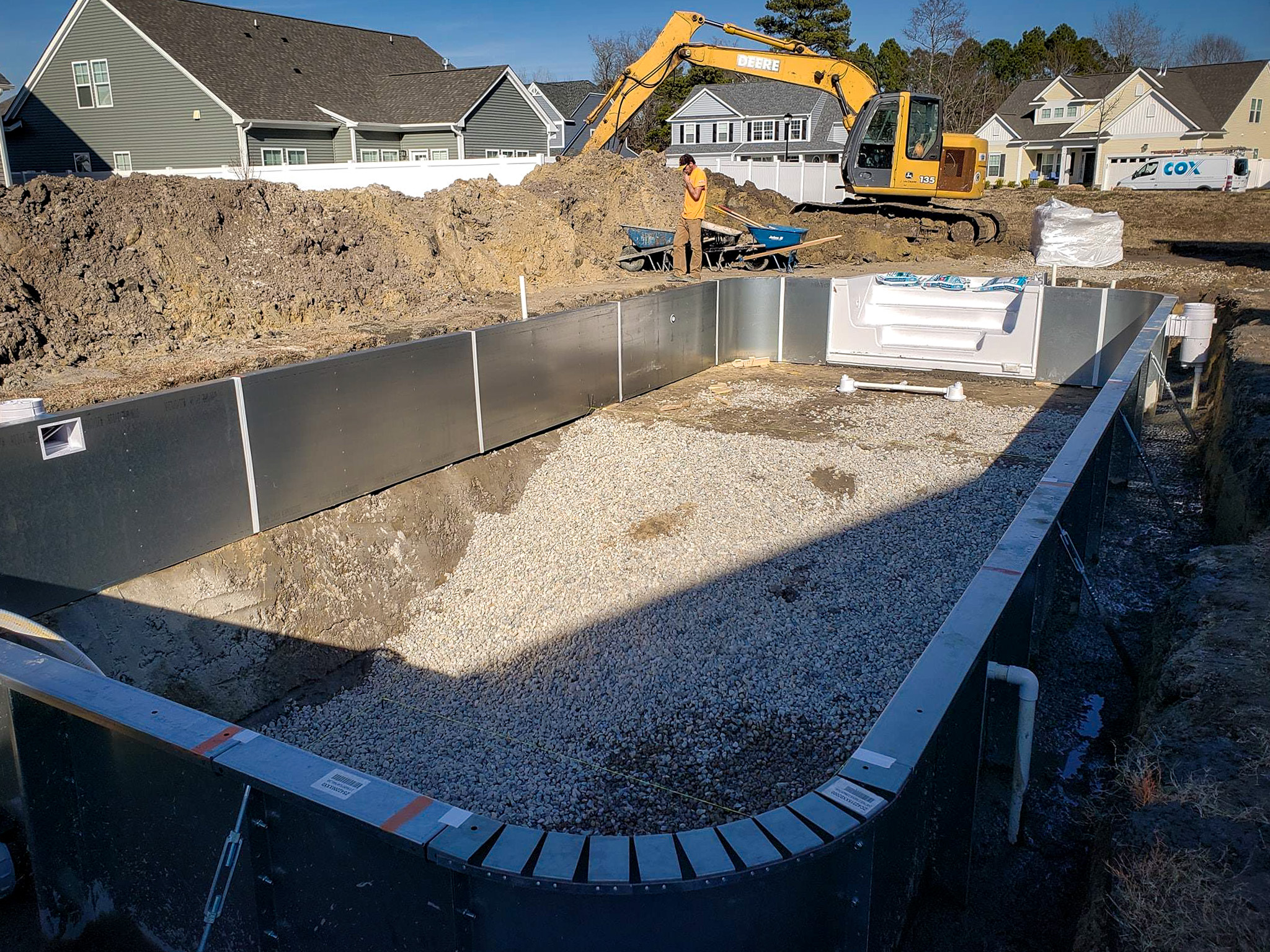 pool builder installing pool tiles